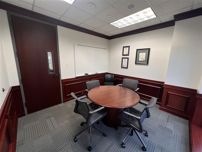 image of a circle conference table and 4 chairs 